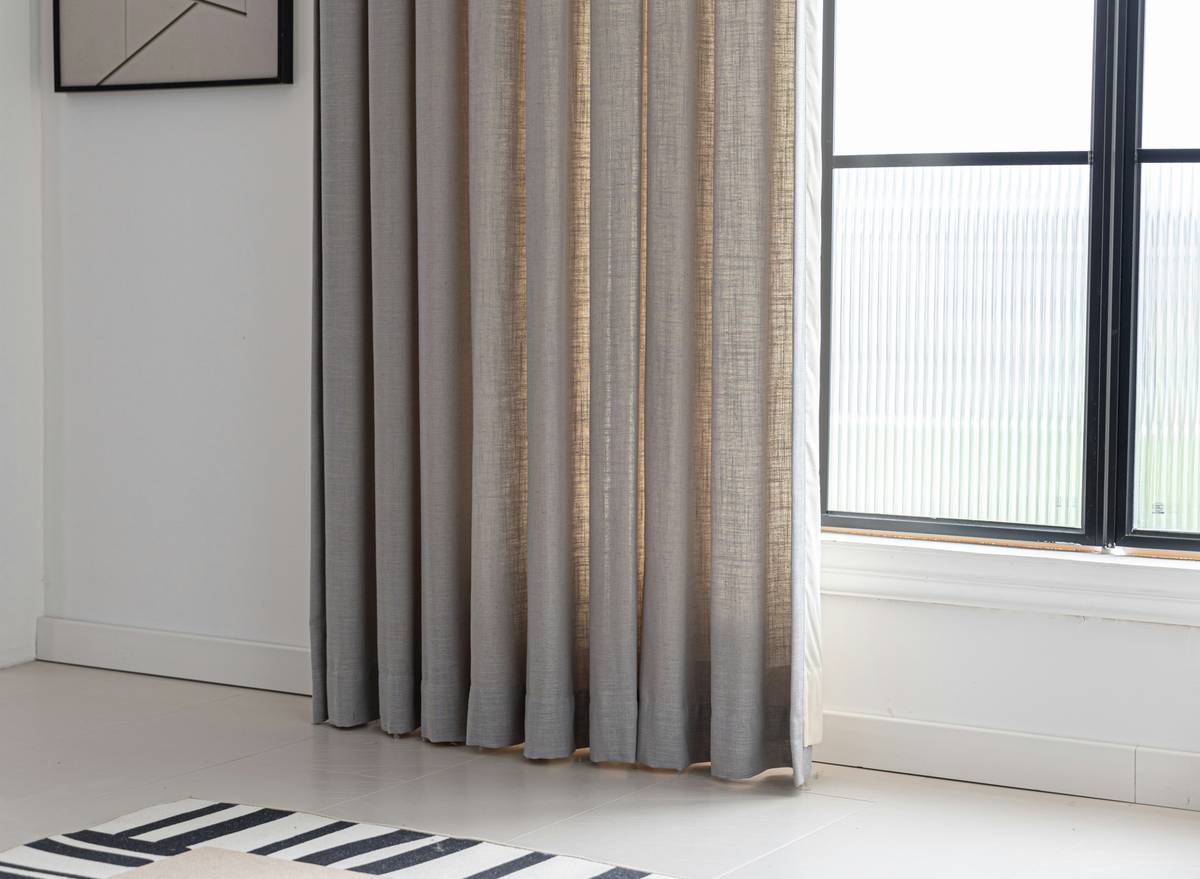 Comparison of interior curtains for home versus outdoor-specific panels in direct sunlight showing UV protection difference